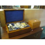 Oak canteen of mixed plated cutlery, together with a tea caddy of plain form(2)