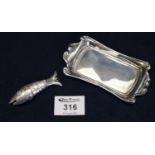 Silver rectangular shaped pin dish with scroll bordering, together with a yellow metal fish with