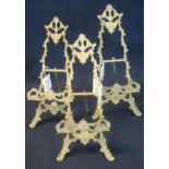 Set of three brass foliate design easel shaped photograph stands. (3) (B.P. 24% incl. VAT)