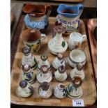 Tray of mainly Torquay pottery souvenir ware to include; vinaigrette, jugs, commemorative coffee can
