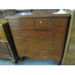Edwardian pine straight front chest of two short and three long drawers with shaped apron on