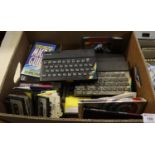 Four Sinclair ZX spectrum computers, together with assorted games, user guides etc. (B.P. 24%