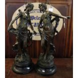 Pair of French spelter musical figurines, Muse Poetique and L'Inspiration on ebonised socle bases.