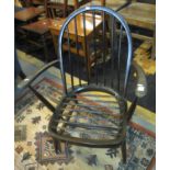 Stained Ercol spindle armchair, lacking seat. (B.P. 24% incl. VAT)