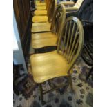 Set of three elm and beech spindle and hoop back kitchen chairs. (3) (B.P. 24% incl. VAT)