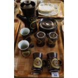 13 piece stoneware pottery coffee set on a brown ground with stylised flowers. (B.P. 24% incl. VAT)