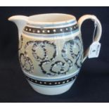 Early 19th Century mocha ware style jug of baluster form with rope twist decoration and coloured