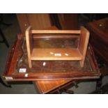 Small teak book trough, together with one oak and one mahogany tray. (3) (B.P. 24% incl. VAT)