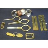 Small box of metalware to include; three pairs of brass dividers, two brass buckles, two military