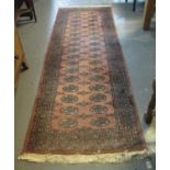 Modern Middle Eastern design runner on a salmon ground with floral and foliate geometric