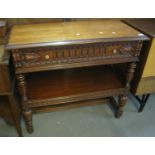 Reproduction carved mahogany single drawer dumbwaiter with under tier on carved fluted supports. (