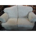 Modern cream ground foliate two seater sofa. (B.P. 21% + VAT)