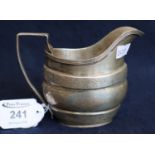 19th Century silver helmet shaped cream jug with geometric and foliate engraved decoration.