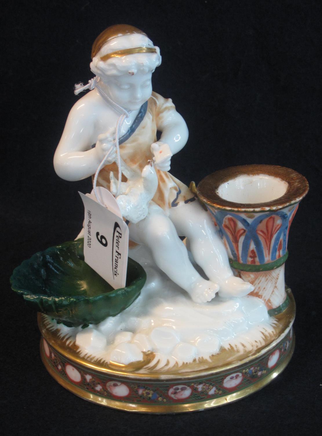 19th Century porcelain taper stick, gilt and enamelled and modelled as a maiden with white dove at a