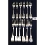 A set of six silver fiddle pattern dinner forks, together with a similar set of six fiddle pattern