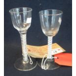 Georgian wine glass with opaque cotton double twist stem and a conical foot, together with another