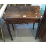Late 19th Century single drawer swivel card table with hinged lid, standing on tapering fluted legs.