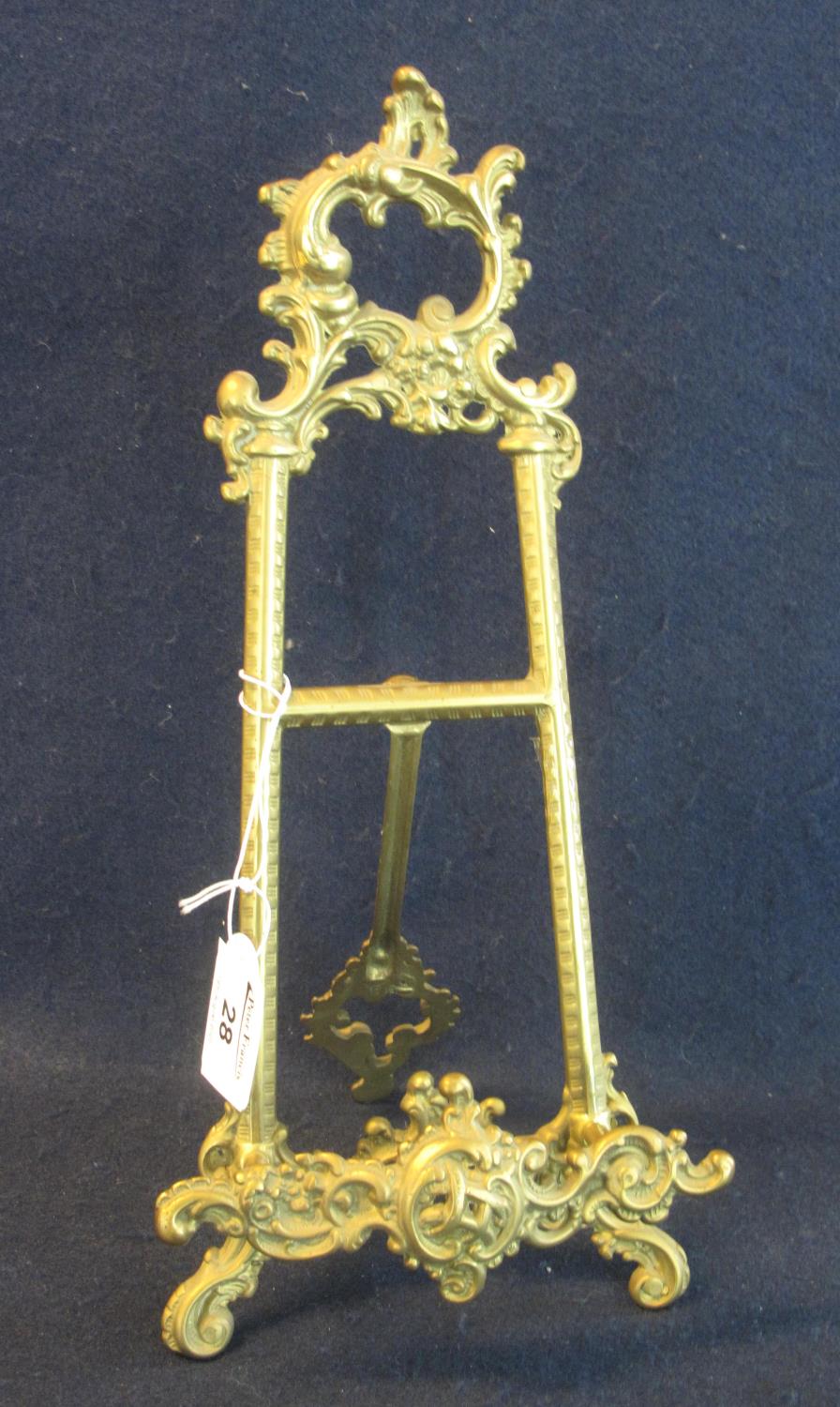 Rococo style brass easel shaped photograph stand. 31cm high approx. (B.P. 21% + VAT)