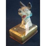 Metal laughing dog toy with tin plate base, the base containing batteries for the light bulb