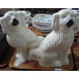 Pair of early 20th Century Staffordshire fireside dogs with painted features. 40cm high approx. (B.