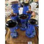 Tray of seven similar Torquay pottery Lemon and Crute vases, all decorated with birds, flowers and