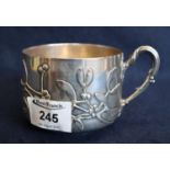 Continental silver chocolate cup having reeded foliate handle and applied mistletoe relief
