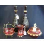 A pair of ruby flash cut mallet shaped decanters and stoppers depicting, stags amongst foliage.