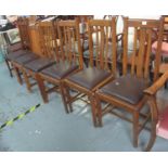 A collection of seven early 20th Century oak slat back dining chairs with drop in seats. (7) (B.P.