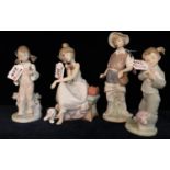 Three Lladro Spanish porcelain figurines, two girls with puppy and bird, together with a Nao Spanish