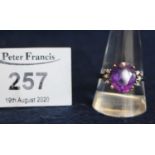A 9ct gold purple stone ring, ring size T. 3.6g approx. (B.P. 21% + VAT) Probably synthetic