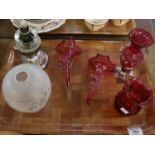 Four items of cranberry glass to include; cream jug, baluster vase and two epergne vessels. Together