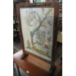 Early 20th Century tapestry firescreen in oak frame depicting squirrel amongst foliage. (B.P.