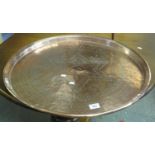 Large copper charger with star and floral decoration. (B.P. 21% + VAT)