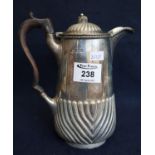 Silver half lobed design baluster coffee pot with hinged cover and ebony handle. London hallmarks.