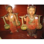Pair of possibly Burmese carved wooden figures of fruit carriers. (B.P. 21% + VAT)