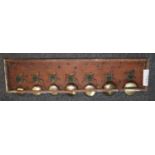A panel of elecrically operated bells for wall mounting, possibly for servants quarters. (B.P. 21% +