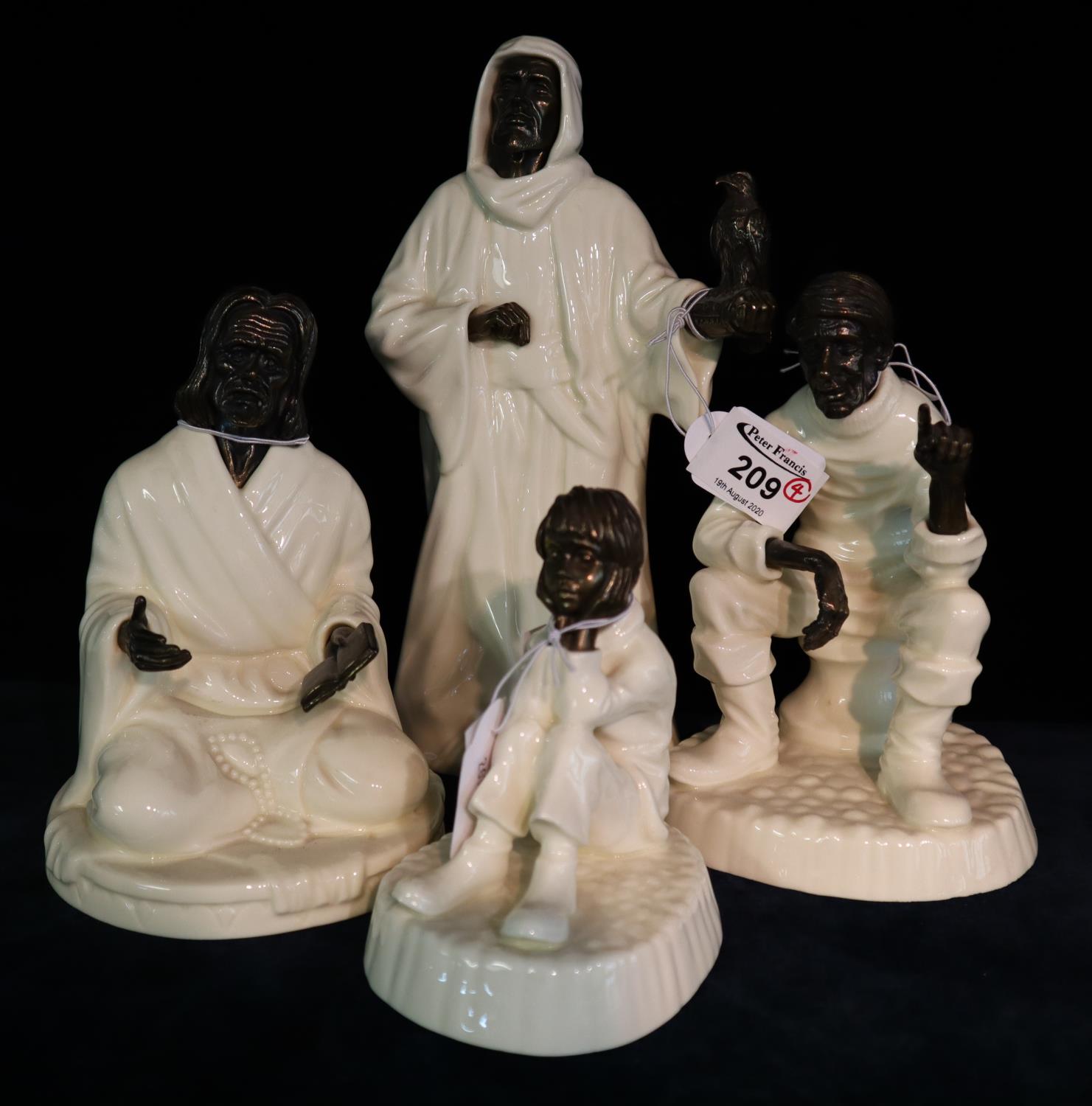 Four Minton bronze and ivory pottery figures to include; 'The Sage', 'Spellbound', 'Travellers