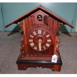 Black forest type oak cuckoo clock of architectural form. 35cm high approx. (B.P. 21% + VAT)