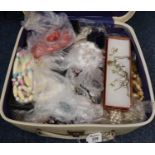 Small suitcase of assorted costume jewellery. (B.P. 21% + VAT)