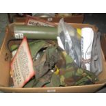 Box containing assorted reproduction militaria items including; camouflage gaters, belts, warning