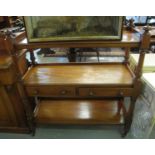 Victorian mahogany dumbwaiter having three tiers with two pull out drawers standing on turned