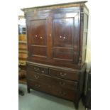 19th Century Welsh oak two stage press cupboard having moulded cornice, two blind panelled doors,