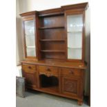 Late 19th Century oak two stage cabinet back dog kennel dresser with carved panels on turned