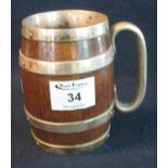Early 20th Century oak coopered barrel shaped mug with silver plated mounts. (B.P. 21% + VAT)
