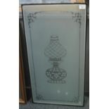 Etched glass door panel decorated with oil lamp within frame. 88 x 44cm approx. (B.P. 21% + VAT)