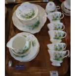 21 piece Royal Albert bone china part teaset on a white and fluted ground with floral and