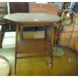 Arts and Crafts design mahogany occasional or lamp table with under tier, together with a brass cake