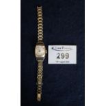 A ladies 9ct gold wristwatch, makers Avia on gilt metal strap. (B.P. 21% + VAT)