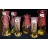 Five Torquay pottery Lemon and Crute vases, together with a baluster water jug. (6) (B.P. 21% + VAT)