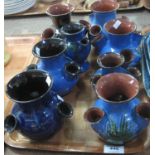 A tray of Torquay pottery Lemon and Crute four section bulb holders on a blue ground with floral and